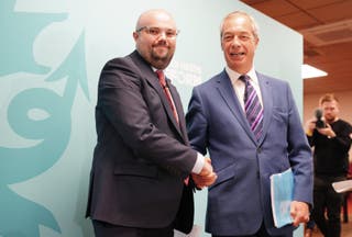 Reform Nigel Farage, the British leader, is shining hands with Llyr Powell (left), chosen as a party candidate for the election.